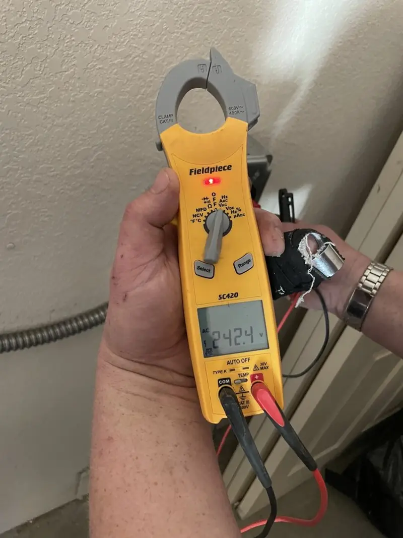Voltage testing with clamp meter during Aluminum Wiring Replacement in Gibraltar